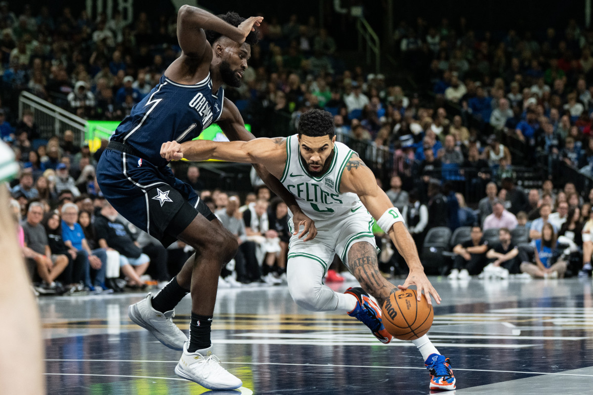Orlando Magic forward Jonathan Isaac (1) defends Boston Celtics forward Jayson Tatum (0) in the two teams' last matchup